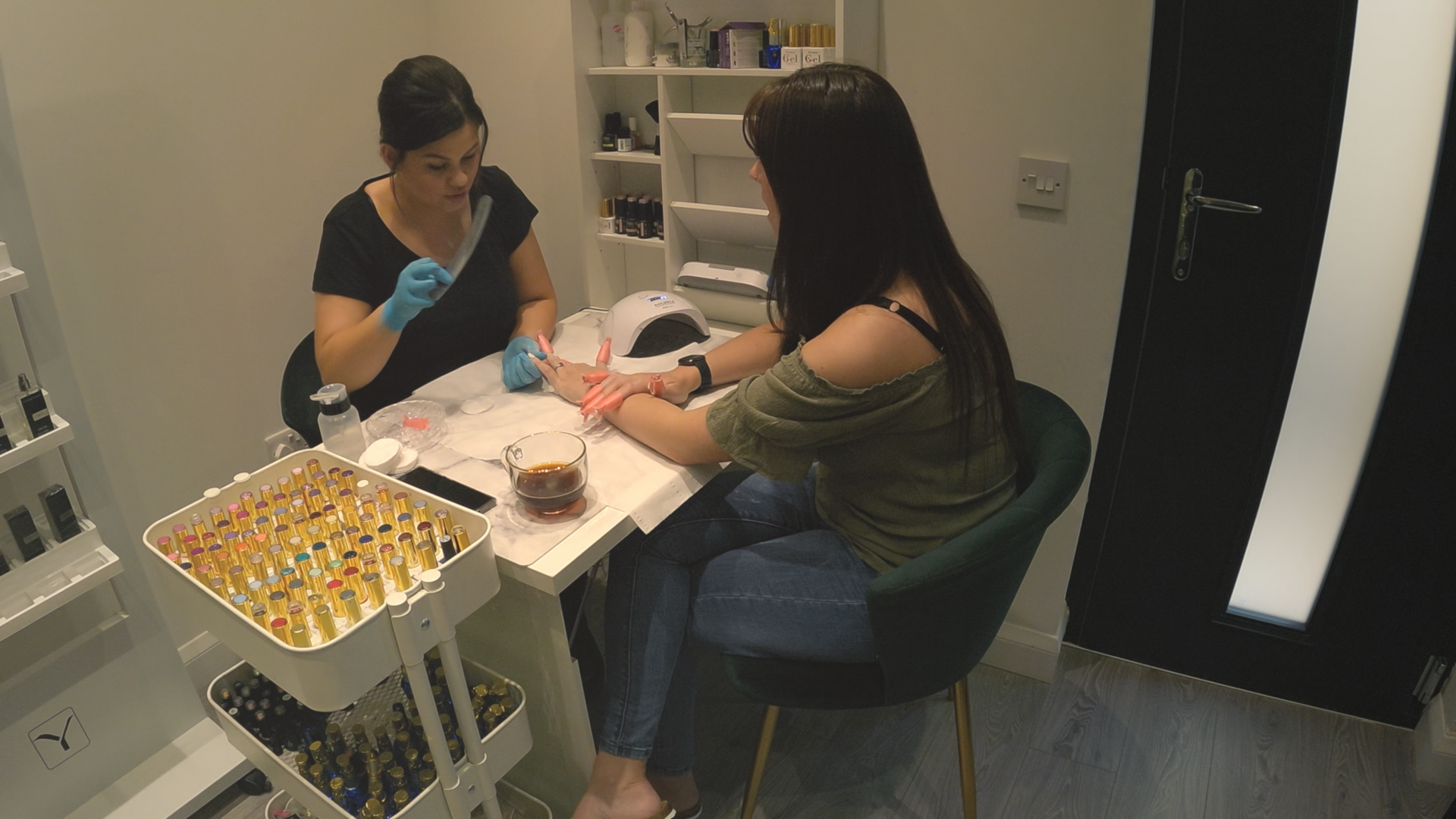 A woman getting her nails done at a salon